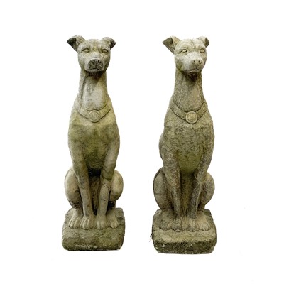 Lot 352 - A pair of reconstituted stone figures of whippets.