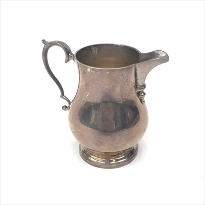 Lot 2104 - A George V silver cream jug by Hamilton &...