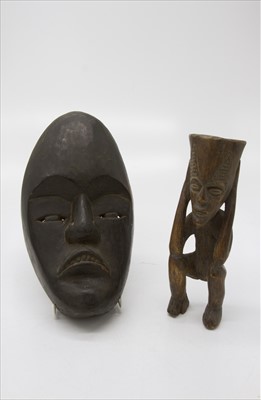 Lot 374 - An African carved wood figure and an African...