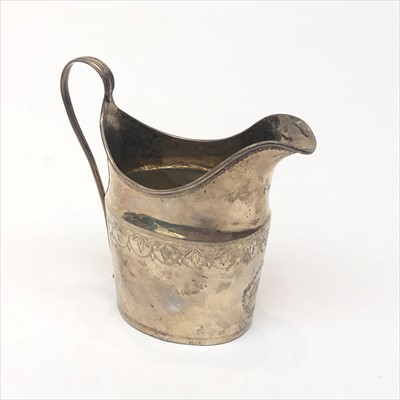 Lot 2107 - An engraved Georgian silver helmet cream jug,...