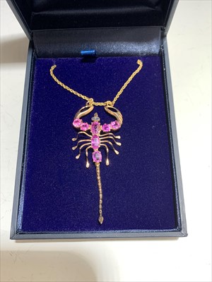 Lot 2459 - A gold and pink sapphire scorpion pendant with...