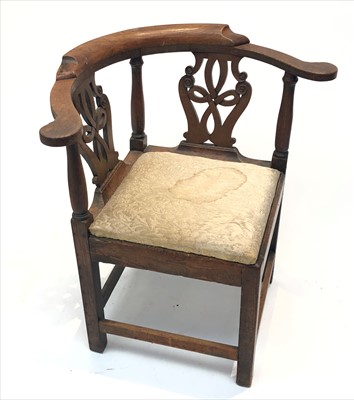Lot 3327 - A George III oak corner armchair, with a...