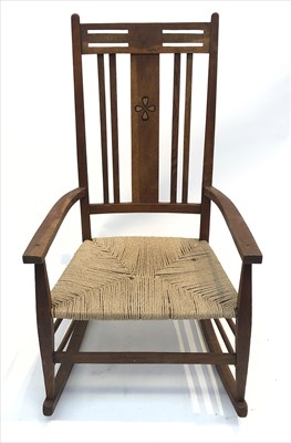 Lot 3329 - An Arts & Crafts inlaid oak rocking chair.