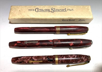 Lot 2439 - Three Conway Stewart red pens, numbers 84,36...