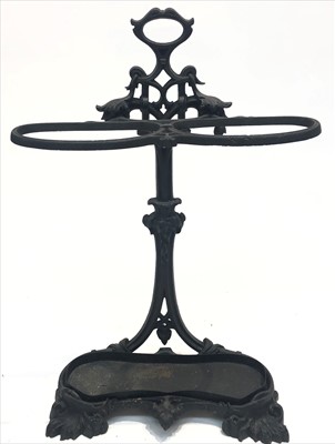 Lot 3339 - A black painted cast iron hall stand.