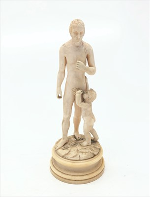 Lot 430 - A 19th century ivory figure of a man and child,...