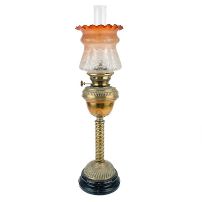 Lot 14 - A Victorian brass oil lamp with a brass oil reservoir and an etched orange glass shade.