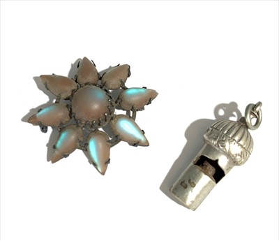 Lot 2465 - A silver whistle and a silver brooch set with...
