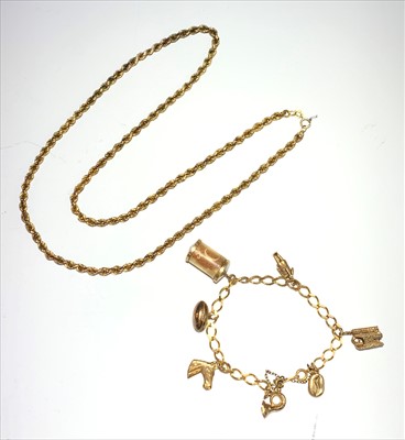 Lot 2518 - A gold charm bracelet and a gold rope necklace,...
