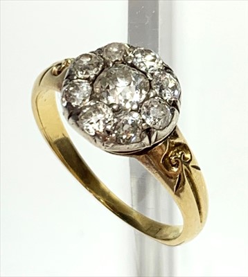 Lot 2519 - A gold ring set a diamond cluster.