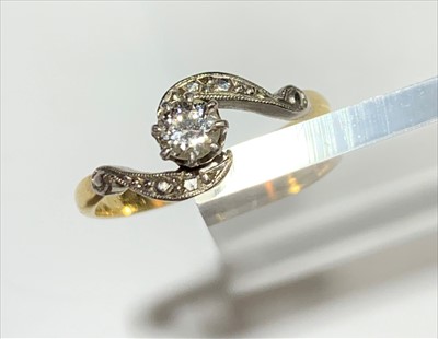 Lot 2525 - A gold ring with solitaire diamond and cross...
