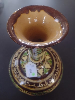 Lot 184 - An Islamic pottery vase, probably Bombay School of Arts, late 19th century.
