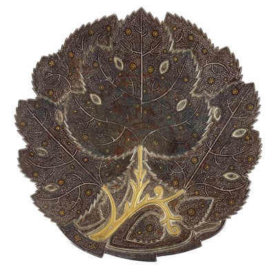 Lot 189 - An Indo-Persian gold and silver koftgari steel plate, 19th century.
