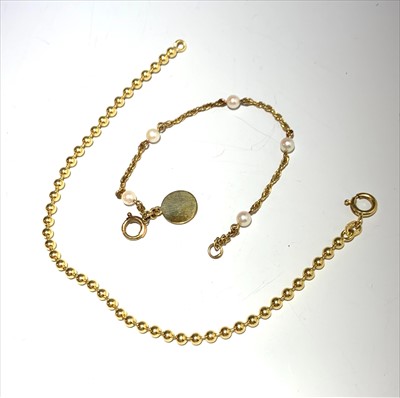 Lot 2674 - A 9ct. gold chain bracelet with spaced pearls...