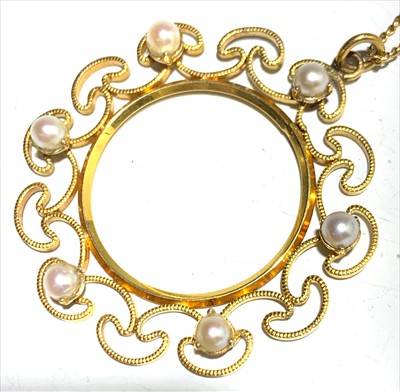 Lot 2634 - A boxed gold and pearl circle pendant with chain.