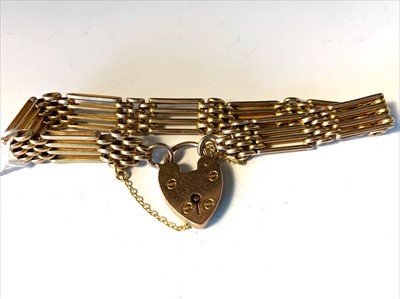 Lot 2646 - A four bar gate linked 9ct bracelet.