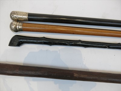 Lot 408 - Two Victorian silver topped wooden walking...