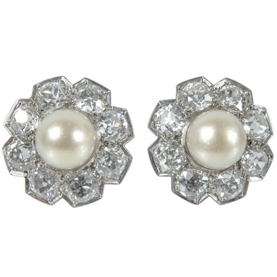 Lot 217 - An impressive early 20th century cultured pearl, diamond set, double-row necklace & earrings suite.