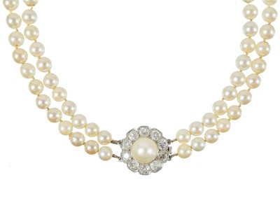 Lot 344 - An impressive early 20th century cultured pearl double-row necklace and earrings suite, diamond set.