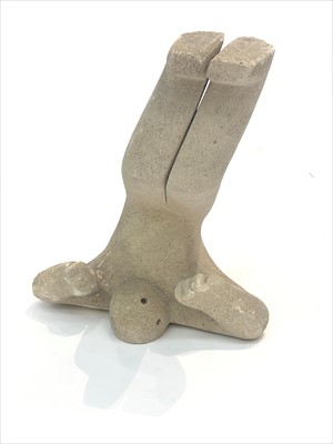Lot 458 - A stylised stone sculpture of man, modelled...