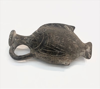 Lot 1497 - An ancient flask in the form of a fish, in...