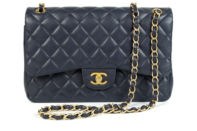 Lot 540 - A Chanel maxi navy blue caviar leather handbag.