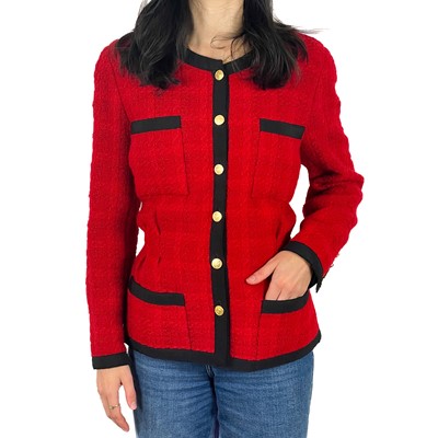 Lot 499 - A Chanel 1980's red boucle jacket with gold plated buttons and black trim.