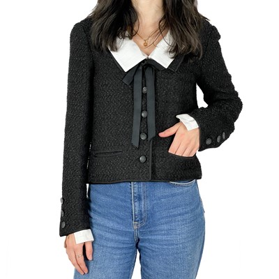 Lot 458 - A Chanel 1960's black and white chenille fabric vintage jacket.