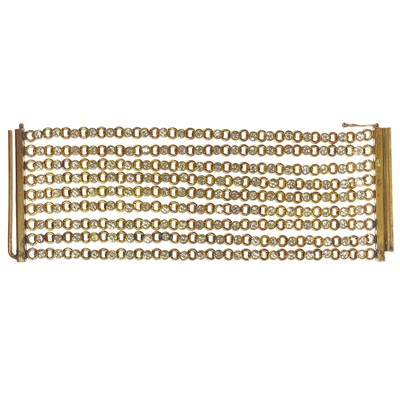 Lot 575 - A rare 1950's Chanel gilt metal crystal set chain link nine row bracelet.
