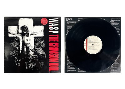 Lot 38 - W.A.S.P 12" album and ticket stubs.