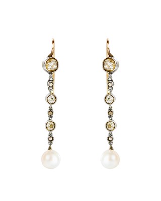 Lot 48 - An Edwardian elegant pair of diamond and pearl pendant earrings.