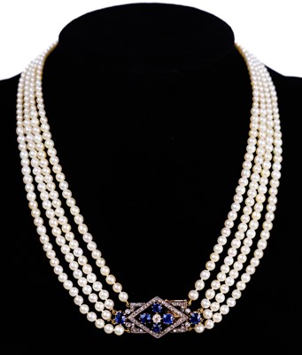 Lot 70 - An exquisite Art Deco four-row natural saltwater pearl choker with diamond and sapphire clasp.