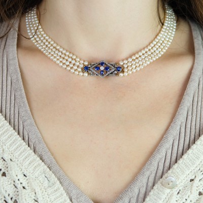 Lot 70 - An exquisite Art Deco four-row natural saltwater pearl choker with diamond and sapphire clasp.