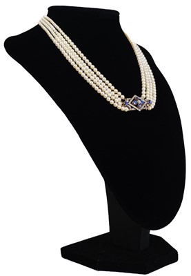 Lot 70 - An exquisite Art Deco four-row natural saltwater pearl choker with diamond and sapphire clasp.