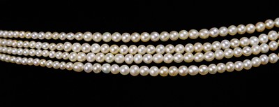 Lot 70 - An exquisite Art Deco four-row natural saltwater pearl choker with diamond and sapphire clasp.