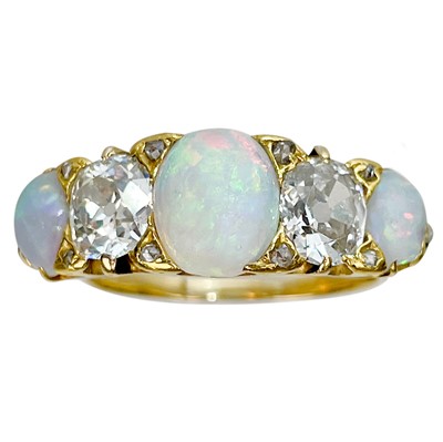 Lot 15 - A good 18ct gold diamond and opal five stone ring.