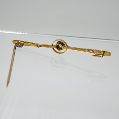 Lot 37 - A 15ct bar brooch target set with a single 0.20ct round cut diamond.