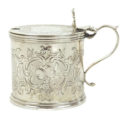 Lot 145 - A Victorian silver mustard pot with blue glass liner by Arthur Sibley.