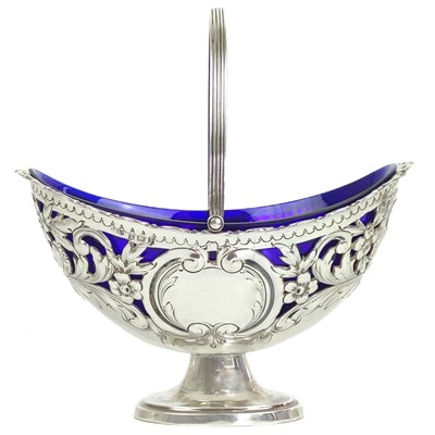 Lot 162 - An Edwardian silver pedestal swing handled sweetmeat dish by Charles Westwood.