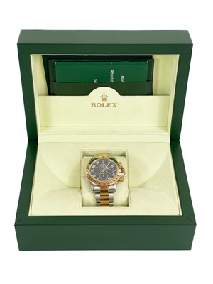 Lot 475 - Rolex - A Rolex Cosmograph Daytona 18ct gold and steel gentleman's bracelet wristwatch, ref. 116523.
