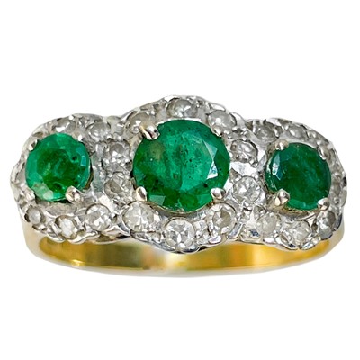 Lot 44 - An 18ct gold emerald and diamond triple cluster ring.