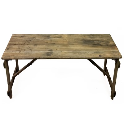 Lot 46 - A pine folding trestle table.