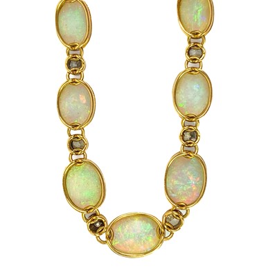 Lot 94 - An attractive early 20th century gold, diamond and blue opal set bracelet.