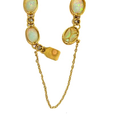 Lot 94 - An attractive early 20th century gold, diamond and blue opal set bracelet.