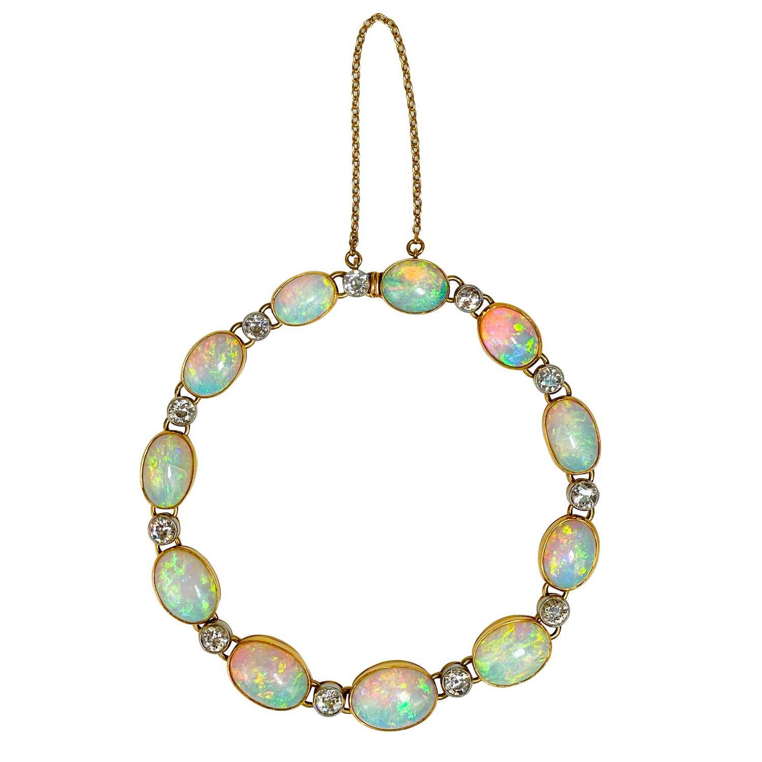 Lot 94 - An attractive early 20th century gold, diamond and blue opal set bracelet.