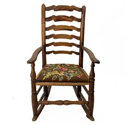Lot 96 - An ash ladder back rocking chair.