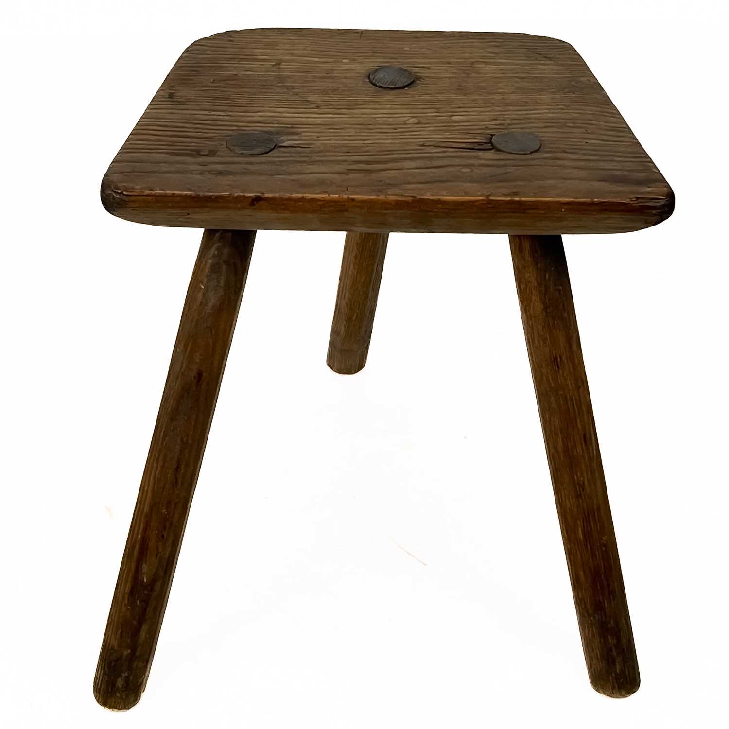 Lot 28 - An ash three legged stool