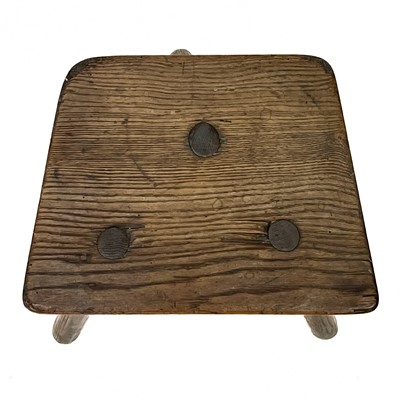 Lot 28 - An ash three legged stool