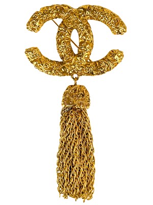 Lot 488 - A Chanel 24ct gold-plated CC lava collection tassel brooch, circa 1993.