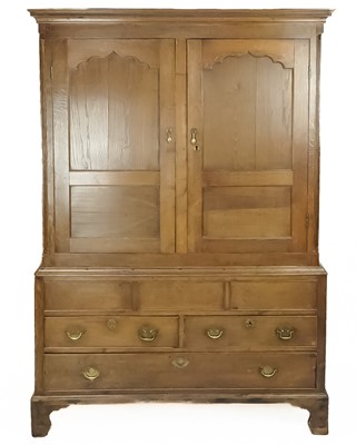 Lot 18 - A George III oak press cupboard.